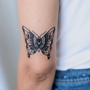 Unique blackwork design by Jenna Jeep, bringing the beauty of a butterfly to your upper arm.