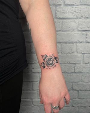 Get inked by Jenna Jeep with a stunning illustrative flower design on your forearm. Stand out with this unique blackwork piece.