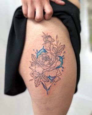 Get a stunning flower tattoo on your upper leg by renowned artist Vic. This illustrative design will make a bold statement.