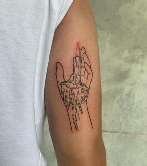 Get a unique and elegant upper arm tattoo of a hand holding a candle, expertly done in fine line illustrative style by artist Holly Hawk.
