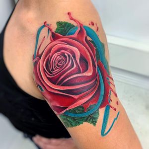 Adorn your upper arm with a stunning illustrative floral design by the talented artist, Daniel Verdysh. Bring your love for nature to life with this beautiful tattoo.