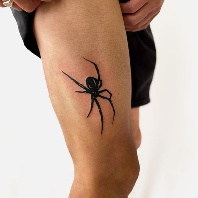 Check out this stunning illustrative tattoo of a spider done by Leo Quintao on the upper leg. Perfect for those who love unique and bold designs.