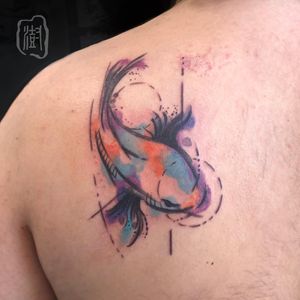 Get a stunning illustrative fish tattoo on your upper back, created by the talented artist Cerf. Stand out with this unique and vibrant design.