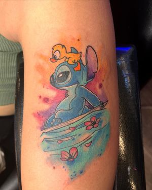 Tattoo uploaded by Erick Cotto-Garcia • Duckling with stitch cruising the  waves • Tattoodo