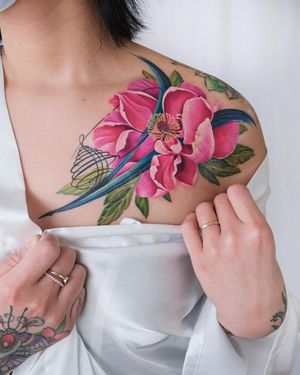 Beautiful illustrative flower tattoo on shoulder by Daniel Verdysh. Perfect for a touch of nature and artistry.