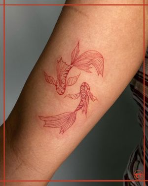 Adorn your arm with a stunning illustrative fish and intricate pattern design expertly crafted by artist Tianna.