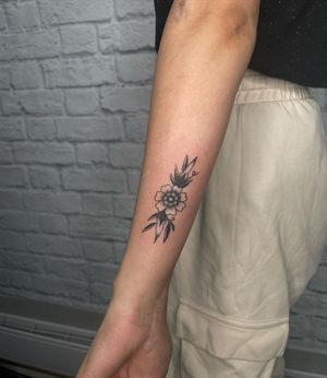 Elegant blackwork design of a flower by the talented Jenna Jeep, perfect for your forearm.