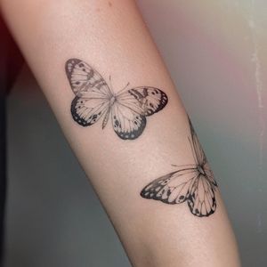 Get a beautifully detailed butterfly tattoo on your upper arm by the talented artist Irene Bogachuk. Fine line and illustrative style.