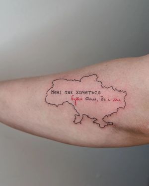 Get a stunning fine line tattoo on your upper arm featuring a world map and meaningful small lettering by Kateryna Tytarenko.
