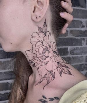 Experience the intricate beauty of Palena's blackwork flower tattoo on your neck. Stand out with this unique and elegant design.