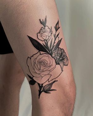Beautiful illustrative flower tattoo by artist Juli Liverinova, perfect for your upper leg. Stand out with this unique blackwork design.
