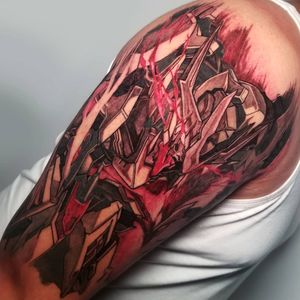 Get inked with this futuristic new school illustrative robot design by Inkcognito on your upper arm. Embrace the power and technology of Gundam!