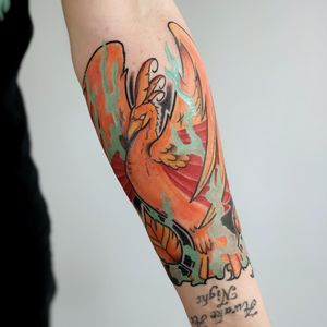 Energize your look with a stunning new school illustrative phoenix tattoo on your forearm. By talented artist Steven Brooks.