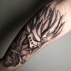 Illustrative and bold tattoo of a samurai man on the forearm by Inkcognito, showcasing intricate blackwork design.