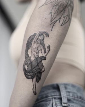 Illustrative black and gray tattoo of a man statue on forearm by Cerf, capturing the essence of strength and power.