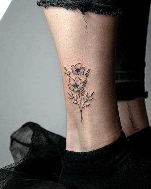 Adorn your ankle with a fine-line illustrative flower tattoo by Kateryna Tytarenko, bringing beauty and elegance to your every step.