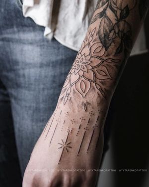 Get mesmerized by Kateryna Tytarenko's intricate dotwork mandala design on your forearm. A stunning blackwork piece.