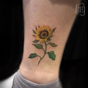 Get a beautifully illustrated watercolor flower tattoo on your ankle by the talented artist Cerf.