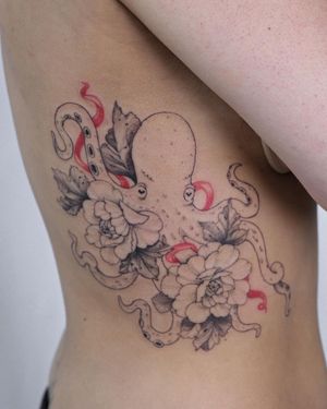 Get inked by Sasha Sunshine with this intricate and unique design combining an octopus and a flower on your ribs.