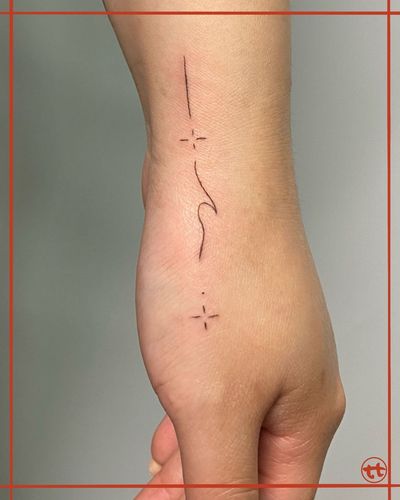 Adorn your hand with this beautiful fine line tattoo featuring a mesmerizing wave pattern design by the talented artist Tianna.