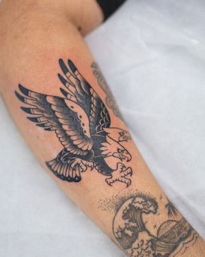 Adorn your skin with a striking blackwork eagle design by artist Steven Brooks. Traditional and illustrative style.