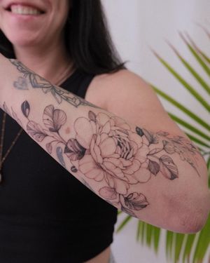 Elegant and detailed floral design for your forearm, done in fine line illustrative style by talented artist Sasha Sunshine.