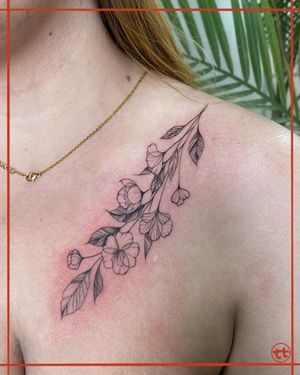 Elegant and detailed flower design on chest, created with precision by talented tattoo artist Tianna. Perfect blend of fine line and illustrative styles.