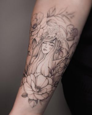 Exquisite floral design on forearm by Irene Bogachuk. A delicate and elegant piece with fine details.