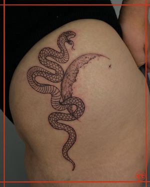 An intricate blackwork and illustrative tattoo featuring a moon and snake design by artist Tianna. Perfect for the upper leg.