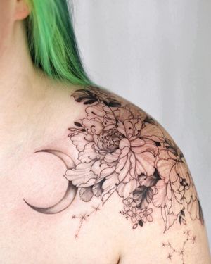 Elegant blackwork illustration of a moon and flower by tattoo artist Sasha Sunshine, perfect for shoulder placement.