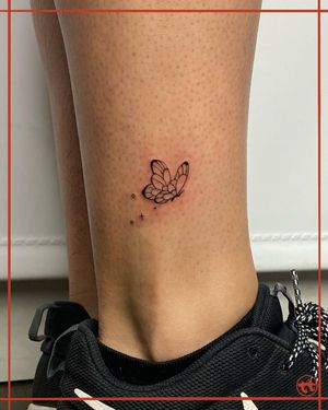 Elegant fine line butterfly tattoo on the ankle by talented artist Tianna. Perfect for those who appreciate delicate and intricate designs.