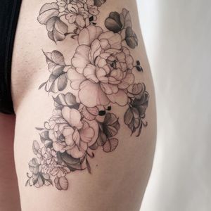 Unique blackwork peony tattoo on upper leg by talented artist Yasmin Clara.