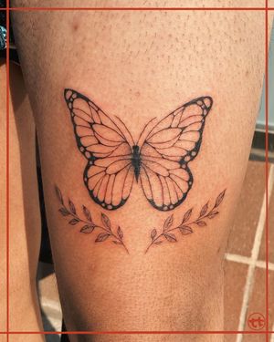 Adorn your upper leg with a delicate and illustrative tattoo featuring a beautiful butterfly and sprig design by artist Tianna.