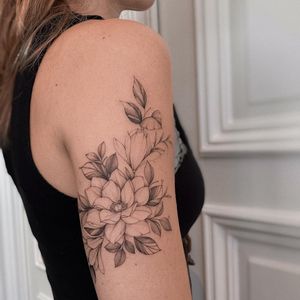 Adorn your upper arm with Irene Bogachuk's exquisite blackwork and ornamental design of a delicate flower.
