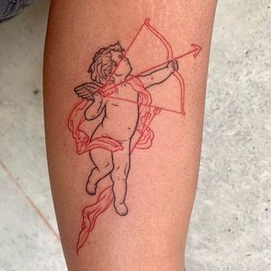 Elegant fine line forearm tattoo featuring an angelic cherub holding a cupid's arrow, designed by the talented artist Holly Hawk.