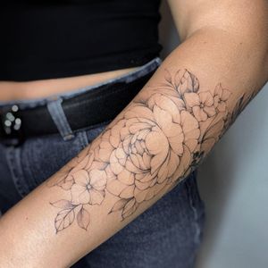 Elegant blackwork floral design by Irene Bogachuk, combining fine line and illustrative styles for a unique look.