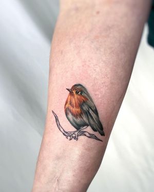 Get inked with a stunning bird design by Vic on your forearm. This illustrative tattoo will make a bold statement.