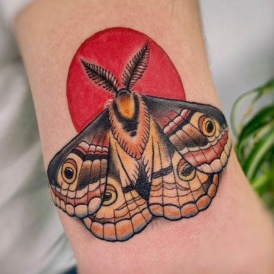 Experience the beauty of nature with this stunning traditional tattoo by skilled artist Steven Brooks.