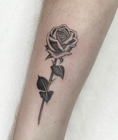 Elegant black and gray flower design by Sophie Rose Hunter, adding a touch of nature to your forearm.