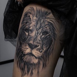 Intricate blackwork design with a fierce lion and unique pattern by artist Nicole Histon. Perfect for upper leg placement.