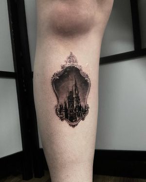 Nicole Histon's illustrative tattoo features a striking blackwork castle framed on the shin, creating a bold and unique design.