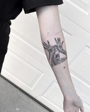 Illustrative blackwork tattoo of a pale man for your forearm, created by talented artist Ali Deeran.