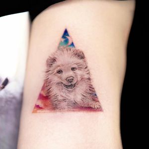 Experience the artistry of Mengni Yang with this stunning realistic dog tattoo on your arm. A perfect tribute to your loyal companion.