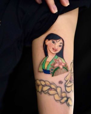 Express your love for Mulan with this stunning illustrative tattoo of a flower girl, beautifully designed by Mengni Yang. Perfect for upper arm placement.