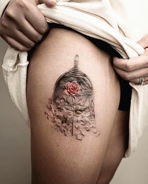 Beautiful illustrative tattoo on upper leg by Mengni Yang featuring a delicate flower and glass design.