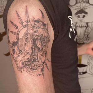 Get a bold blackwork hannya devil tattoo on your upper arm by the talented artist Pablo. The devil mask and spikes create a fierce and captivating design.