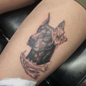 Experience the artistry of Pablo with a striking blackwork tattoo featuring a realistic dog skull motif on your upper leg.