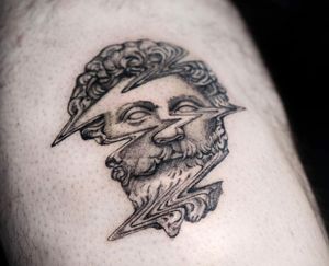 Experience the mystique of blackwork and surrealism with this illustrative tattoo of a man resembling a statue, by the talented artist Oek. Perfect for your arm!