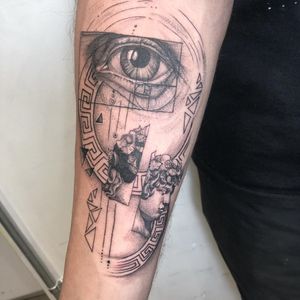 Fine line and illustrative tattoo by Pablo featuring a geometric eye and statue design inspired by Fibonacci patterns.