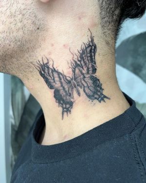 Get stunning blackwork butterfly tattoo on your neck by talented artist Pablo. This illustrative design will make you stand out.